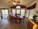 Bright dining room with large window and wooden table at 2179 S Cherokee Ave, Apache Junction, AZ 85119