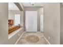 Bright entryway with tile flooring and arched entry to the living room at 3514 E Parkview Dr, Gilbert, AZ 85295