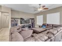 Spacious living room with large sectional sofa and entertainment center at 3514 E Parkview Dr, Gilbert, AZ 85295