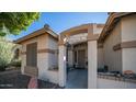 Covered entrance with a decorative arch and string lights at 7585 W Tumblewood Dr, Peoria, AZ 85382