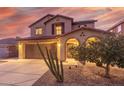Two-story house with a two-car garage and desert landscaping at 2660 S 172Nd Dr, Goodyear, AZ 85338