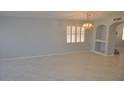 Spacious dining room with tile floors and built-in shelving at 18071 W Douglas Way, Surprise, AZ 85374