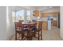 Bright kitchen with a breakfast nook and wood cabinets at 6518 W Sonora St, Phoenix, AZ 85043