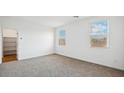Spacious bedroom with neutral carpeting and ample closet space at 9911 S Caballo Dr, Apache Junction, AZ 85120