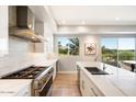 Modern kitchen with stainless steel appliances and mountain views at 16580 N 92Nd St # 2001, Scottsdale, AZ 85260