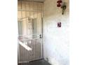 Secured entry door with security gate and fire alarm at 214 E Ruth Ave # 107, Phoenix, AZ 85020