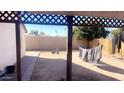 Large backyard with covered patio, grassy area, and space for outdoor activities at 9618 N 66 Dr, Glendale, AZ 85302