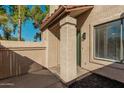 Front view of a charming stucco home with a green door and well-maintained landscaping at 839 S Westwood -- # 182, Mesa, AZ 85210