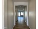 Bright and spacious hallway with tile flooring at 16092 W Questa Dr, Surprise, AZ 85387