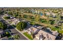 Community overview featuring homes, golf course and lake at 1322 W Indigo Dr, Chandler, AZ 85248