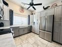 Modern kitchen with stainless steel appliances and white cabinets at 20 E Aero Rd, Mesa, AZ 85205