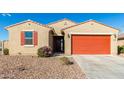 One-story home with a two-car garage and desert landscaping at 4512 W Suncup Dr, San Tan Valley, AZ 85144