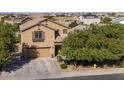 Two-story house with a driveway and front yard, located in a residential area at 40244 W Walker Way, Maricopa, AZ 85138