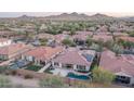 Luxury home with solar panels and private pool, aerial view at 1808 W Horsetail Trl, Phoenix, AZ 85085