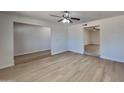 Bright and spacious living room with wood-look flooring and ceiling fan at 887 W Shannon St, Chandler, AZ 85225