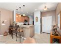 Kitchen with granite countertops, stainless steel appliances, and light wood cabinets at 21613 N 261St Ave, Buckeye, AZ 85396