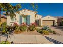 Two-story home with landscaping and a two-car garage at 10728 E Tarragon Ave, Mesa, AZ 85212