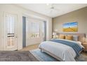 Bright bedroom with large windows and access to a private balcony at 16420 N Thompson Peak Pkwy # 1009, Scottsdale, AZ 85260