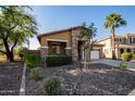 House with stone accents, landscaping, and a two-car garage at 4742 S Twinleaf Dr, Gilbert, AZ 85297