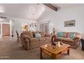 Bright living room with comfortable seating and a cozy fireplace at 2164 E Fairview Ave, Mesa, AZ 85204