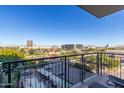 Relaxing balcony with scenic city views and lush parkland at 200 W Portland St # 614, Phoenix, AZ 85003