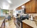 Kitchen boasts granite countertops and ample cabinetry at 4120 N 78Th St # 201, Scottsdale, AZ 85251