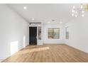 Bright and airy living room with light wood floors at 10646 E Butherus Dr, Scottsdale, AZ 85255