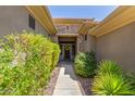 Inviting entryway with stone accents and lush landscaping at 41619 N River Bend Rd, Anthem, AZ 85086