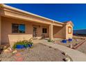 Front entrance with walkway and desert landscaping at 31216 W Blue Sky Way, Buckeye, AZ 85326