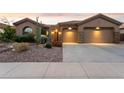 Two-story home with stucco exterior and two-car garage at 40806 N Lytham Ct, Anthem, AZ 85086