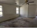 Spacious bedroom with neutral walls and carpeted floors at 5020 S 25Th Ave, Phoenix, AZ 85041