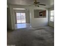Open living room with views to the backyard and kitchen at 5020 S 25Th Ave, Phoenix, AZ 85041