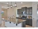 Spacious kitchen featuring granite countertops and stainless steel appliances at 16375 S 180Th Dr, Goodyear, AZ 85338