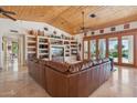 Spacious living area with a sectional sofa and access to the pool at 25210 N 90Th Way, Scottsdale, AZ 85255