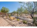 Private patio with fire pit and a view of the community at 767 E Cobble Stone Dr, Queen Creek, AZ 85140