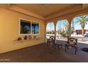 Covered porch with seating area and view of the backyard at 10637 W Welk Dr, Sun City, AZ 85373