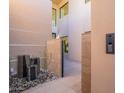 Private courtyard with water feature and gated entry at 37200 N Cave Creek Rd # 1002, Scottsdale, AZ 85262