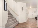 Carpeted staircase with wooden handrail at 18525 N Madison Rd, Maricopa, AZ 85139