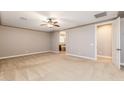 Spacious main bedroom with plush carpet and ensuite bath access at 10331 E Starion Ave, Mesa, AZ 85212