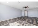 Simple bedroom with neutral walls and laminate wood flooring at 9645 E Theia Dr, Mesa, AZ 85212
