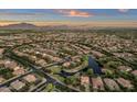 Neighborhood aerial view with lake and mountain backdrop at 3574 E Glacier Pl, Chandler, AZ 85249