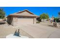 Front view of the house, showcasing the garage and landscaping at 13432 W Ballad Dr, Sun City West, AZ 85375