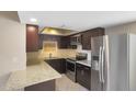 Modern kitchen with stainless steel appliances and granite countertops at 7402 E Carefree Dr # 209, Carefree, AZ 85377