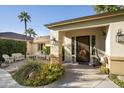 Inviting front entrance with covered porch, decorative door, and landscaping at 5316 E Osborn Rd, Phoenix, AZ 85018