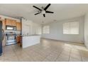 Kitchen with island, stainless steel appliances, and wood cabinets at 1434 E Romley Ave, Phoenix, AZ 85040