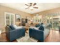 Comfortable living room with hardwood floors and two sofas at 13349 N 87Th Ln, Peoria, AZ 85381