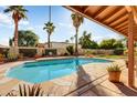 Inviting swimming pool with flagstone decking at 15863 N 46Th Pl, Phoenix, AZ 85032