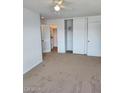 Bright bedroom with carpet, closet, and ceiling fan at 5906 W Townley Ave, Glendale, AZ 85302