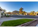 Landscaped courtyard with mountain views and a community area at 4609 E Valley View Dr, Phoenix, AZ 85044