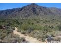 Aerial view showcasing a desert landscape with mountains in the background at 20209 W San Miguel Ave, Litchfield Park, AZ 85340